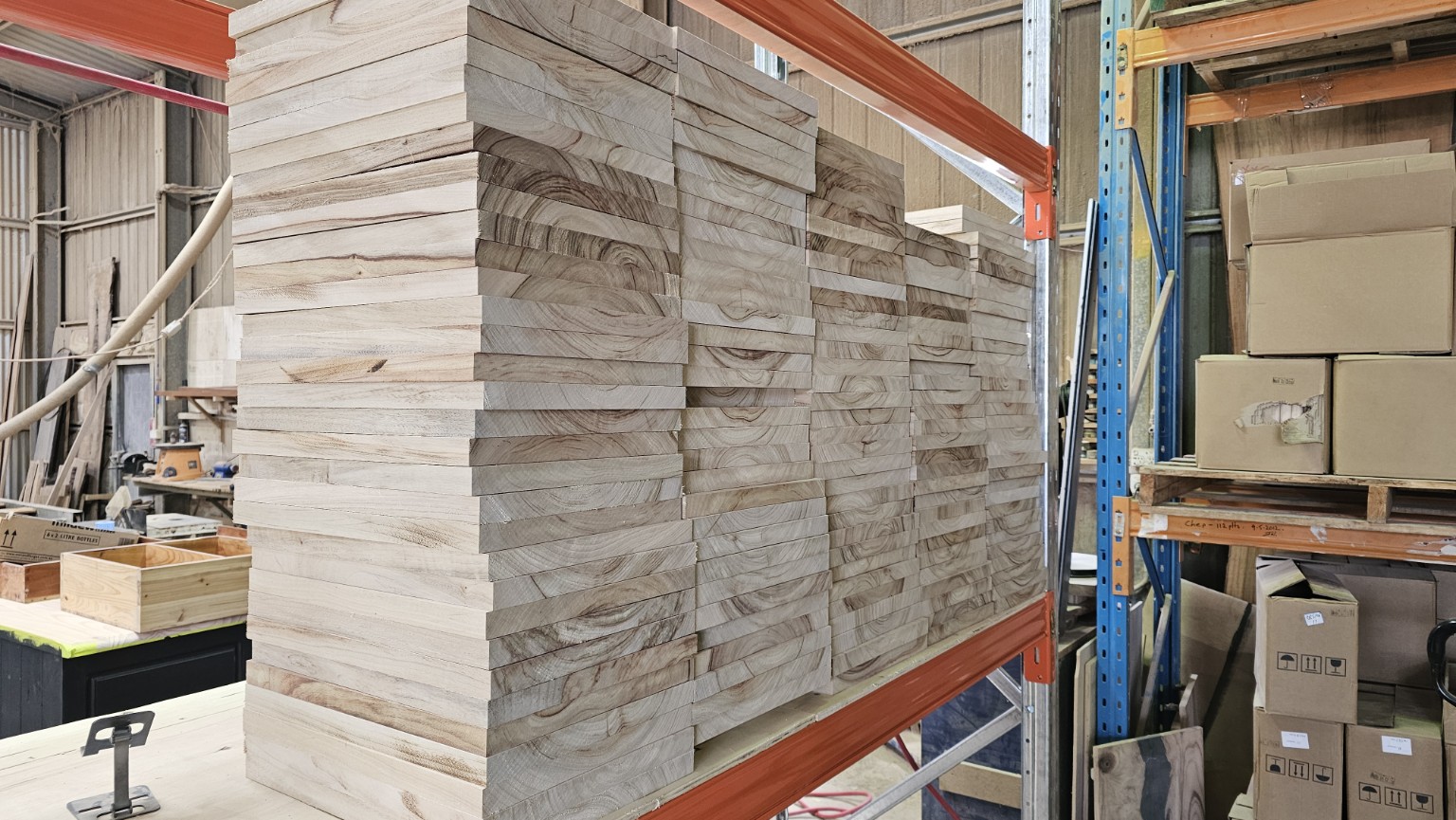 Stacks of sawn timber boards on warehouse racking